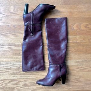 Maroon knee high leather Theory boots with black braid trim.